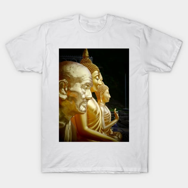 3 Buddhas seated, Thailand. One depicted as an old man. T-Shirt by JonDelorme